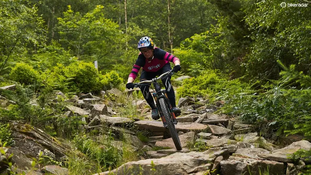 A mountain biker on a rough trail